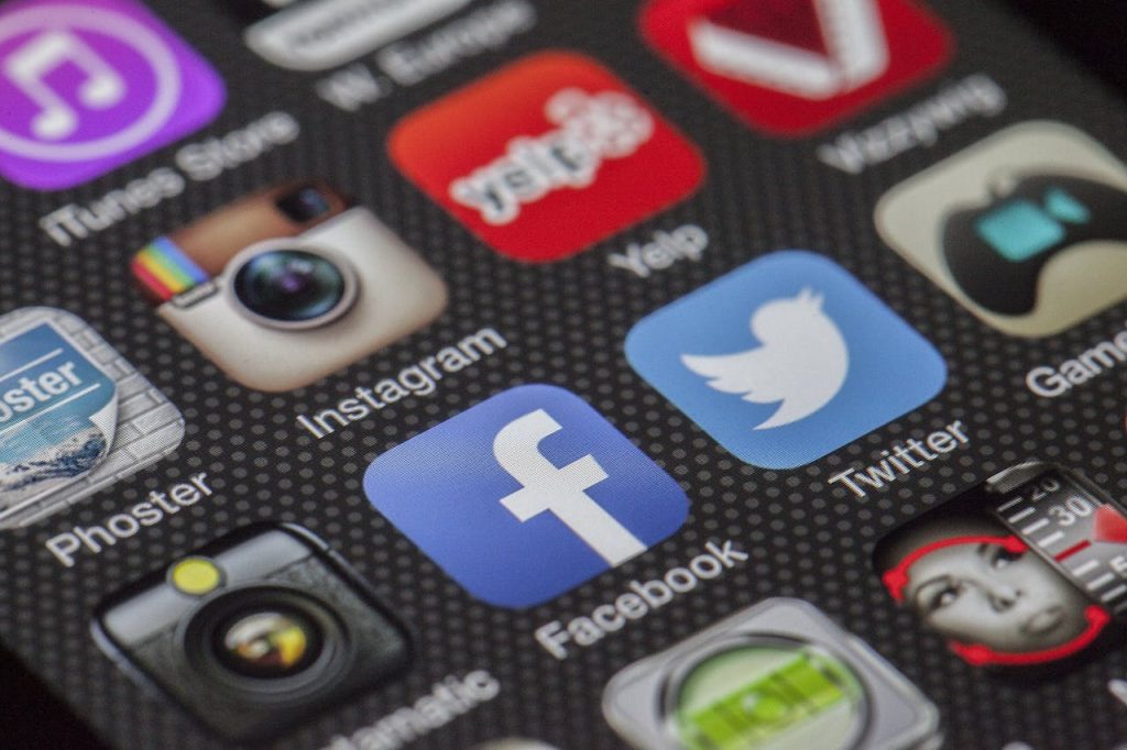 Close-Up Image Of Various Social Media App Icons On A Smartphone Screen.