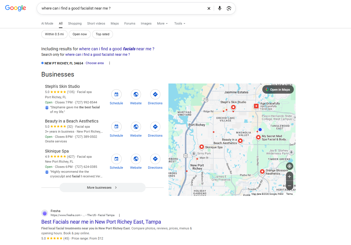 Organic SEO vs. Google Ads: Which Should Your Small Business Choose? Google search results for 'where can I find a good facialist near me' showing local facial spas in New Port Richey, FL